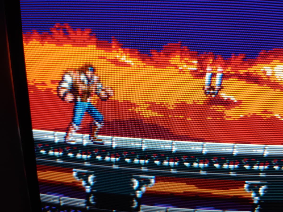 Sony PVM-14L2 neck board during maintenance with recapping work visible, anode cap regreasing in progress on professional monitor repair.