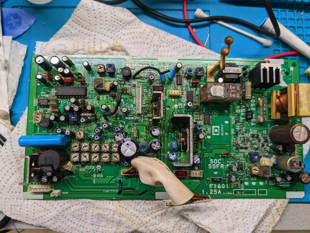 Sony BVM-9045QD deflection board with recapped capacitors marked; old caps marked with dashes, new ones with dots; 1000uF capacitor notably oversized.
