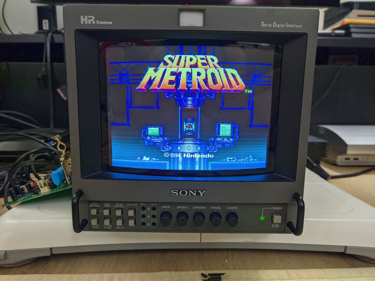 Sony BVM-9045QD displaying Super Metroid title screen after full restoration; color board and neckboard repairs completed.