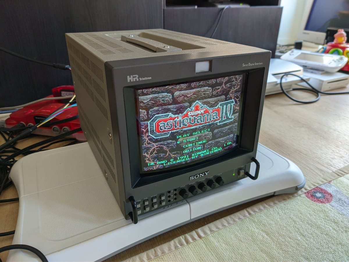 Restored Sony BVM-9045QD CRT monitor displaying Castlevania IV arcade title screen, mounted on HR Trinitron stand during SNES testing post-repair.