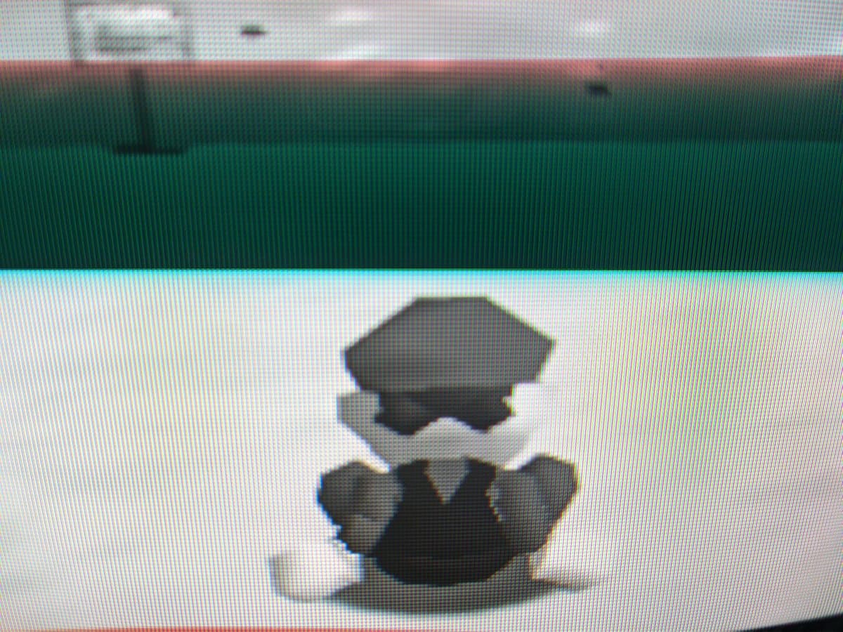 Three stacked Sony PVM-9040 CRT monitors displaying Mario character on screen, testing N64 video output after repair.