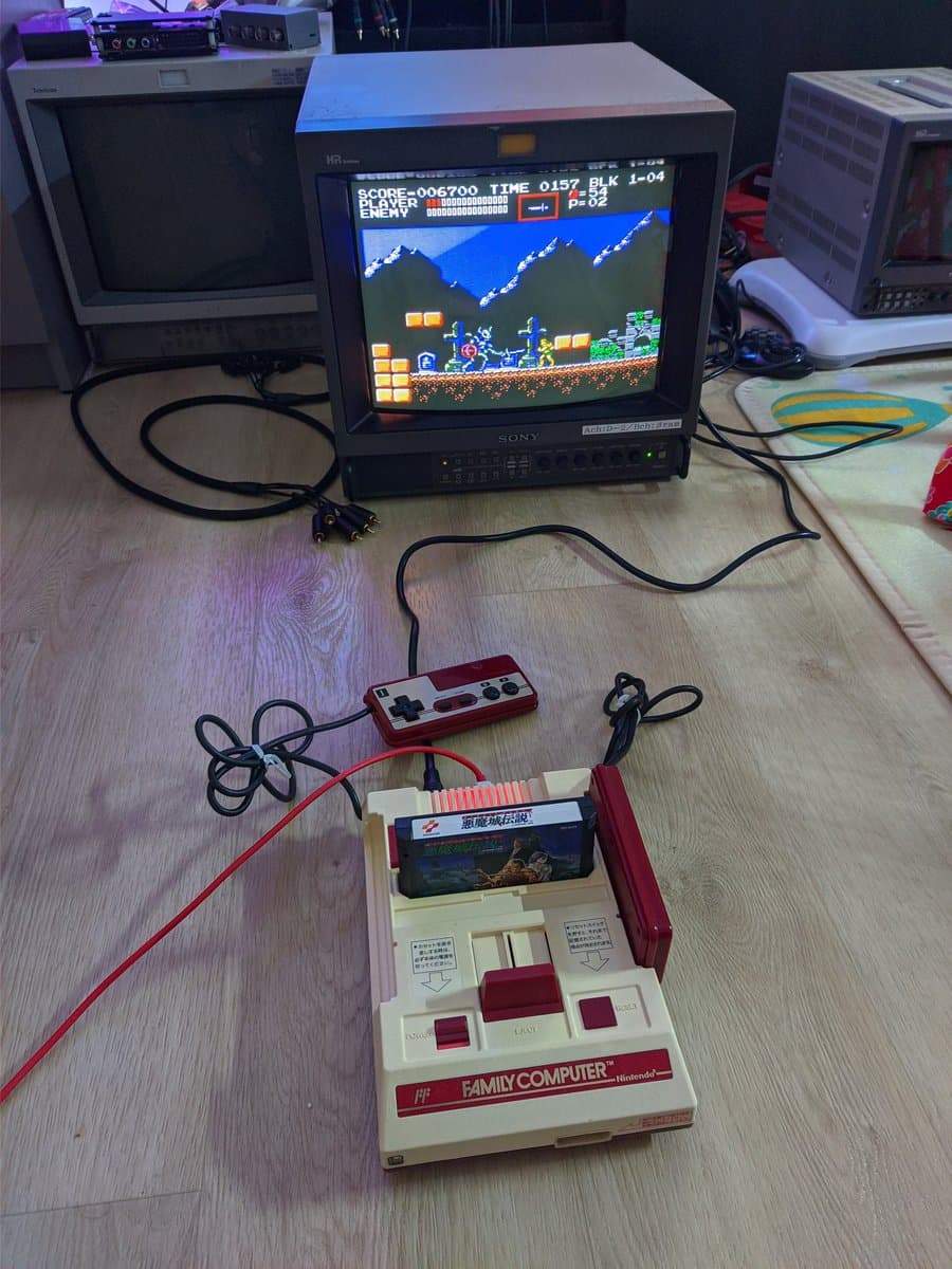 Nintendo Famicom with composite mod board running Castlevania 3, displayed on Sony CRT monitor with wireless controller.