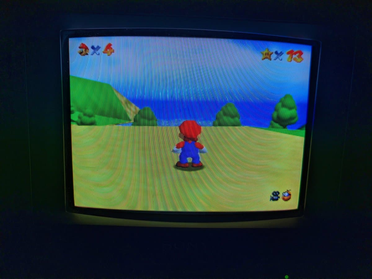 Sony PVM-9040 displaying Super Mario Bros gameplay; monitor #2 of triplet set, showing restored functionality post-repair.