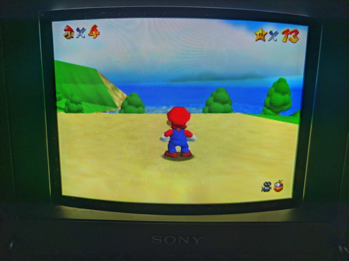 Sony BVM-9045QD displaying Super Mario Bros after restoration; red color channel previously missing due to broken neckboard solder joint.