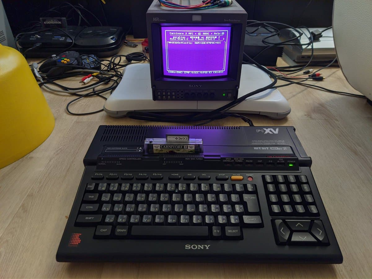 Sony HB-F1XV MSX2+ with Carnivore 2 flashcart installed, displaying Castlevania on composite video through Sony CRT monitor; keyboard and cartridge slot visible.