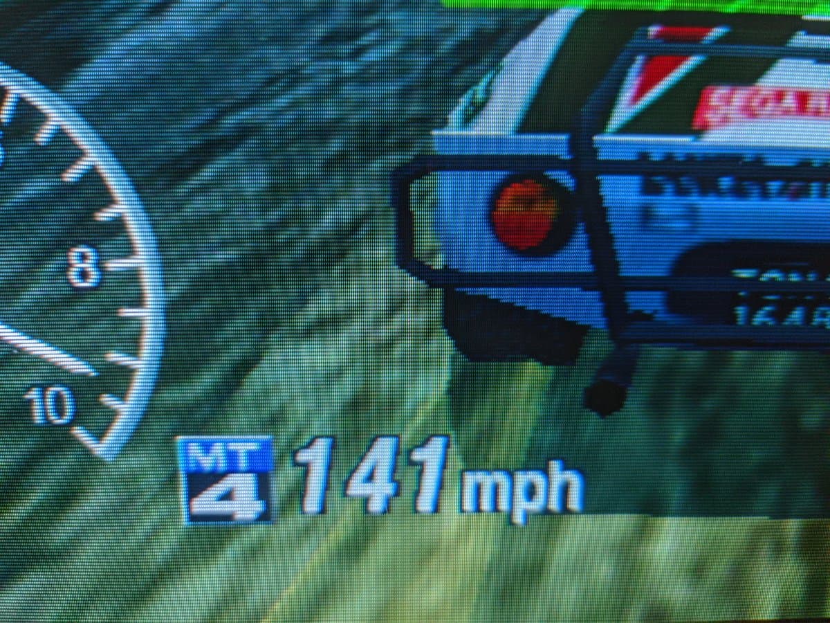 Sony CPD-G420 displaying Sega Rally at 14.1 mph with RetroTINK 5x upscaler, showing geometry correction post-G2 calibration repair.