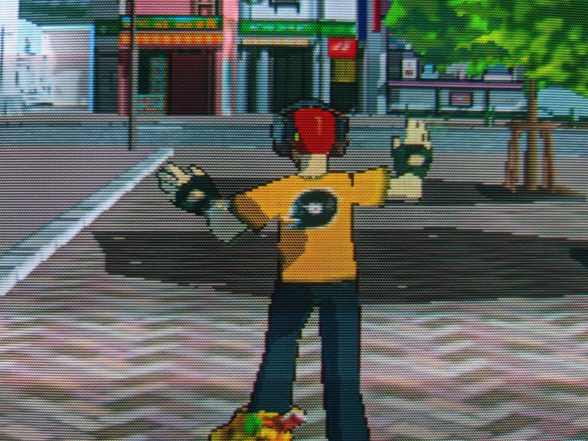 Jet Set Radio gameplay on Sony CPD-G420 CRT after G2 voltage calibration repair, showing character in yellow shirt with red hair on street.