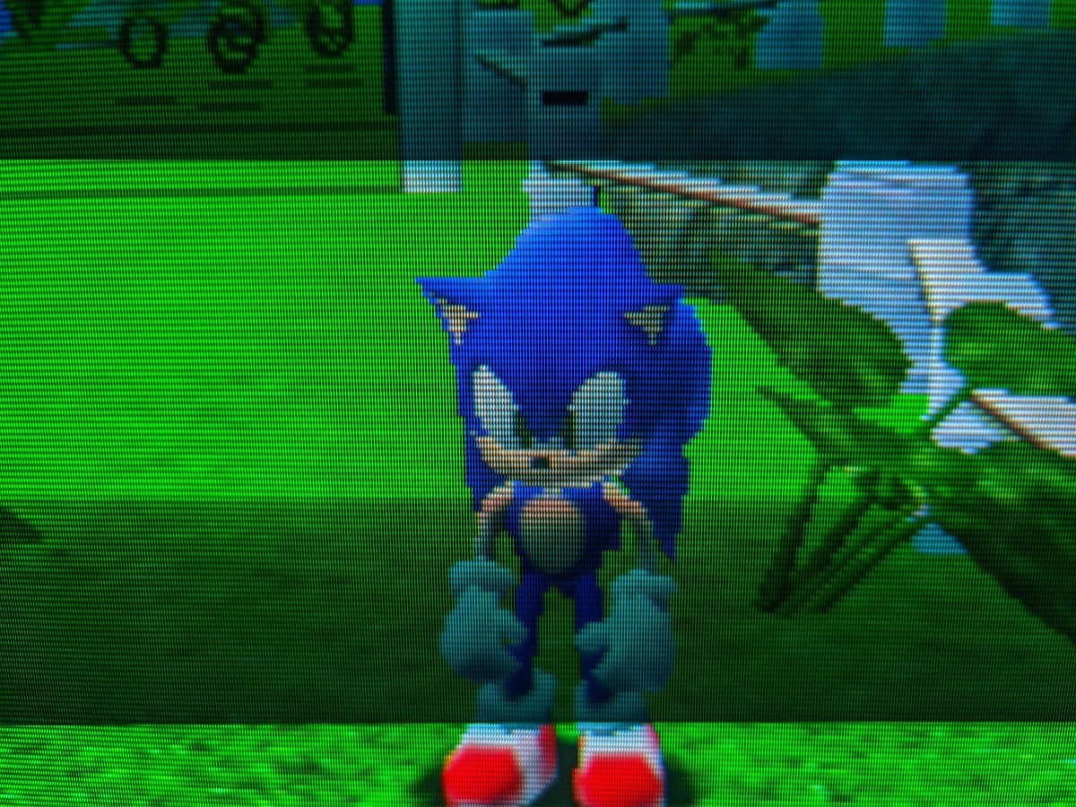 Sonic Adventure gameplay on Sony CPD-G420 CRT after G2 voltage calibration repair, showing character in green field environment.