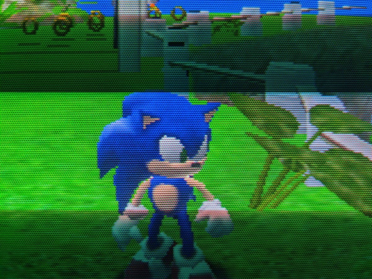Sonic Adventure gameplay on Sony CPD-G420 CRT after G2 voltage calibration repair, showing character in green field environment.