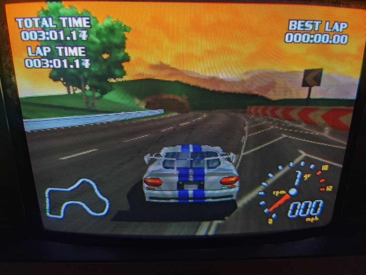 World Driver Championship running on N64 in hi-res mode on Sony PVM-9040, displaying blue Dodge Viper on track with lap timer and HUD visible.