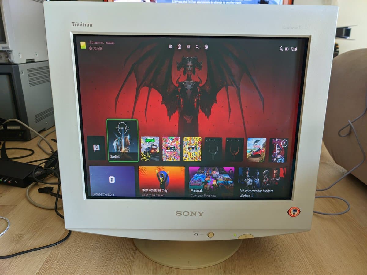 Sony CPD-E430 CRT displaying PlayStation 5 home screen at 1080p; Xbox Series X confirmed working, PS5 display output issue being investigated.
