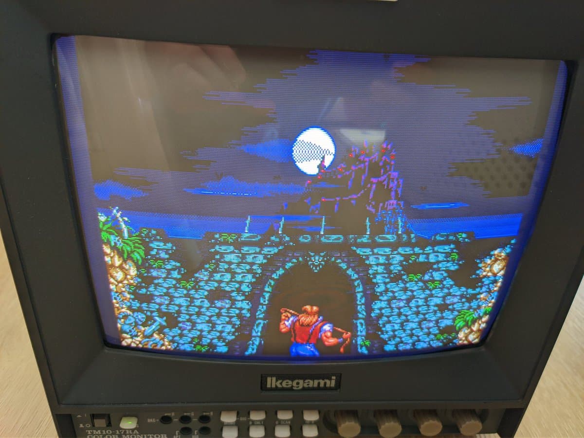 Ikegami TM10-17RA CRT displaying Altered Beast arcade game; monitor successfully running after voltage reconfiguration modification.