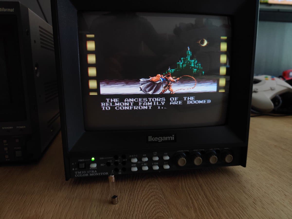 Ikegami TM10-17RA monitor displaying Castlevania intro scene; mechanical shock damage repair completed, monitor operational.