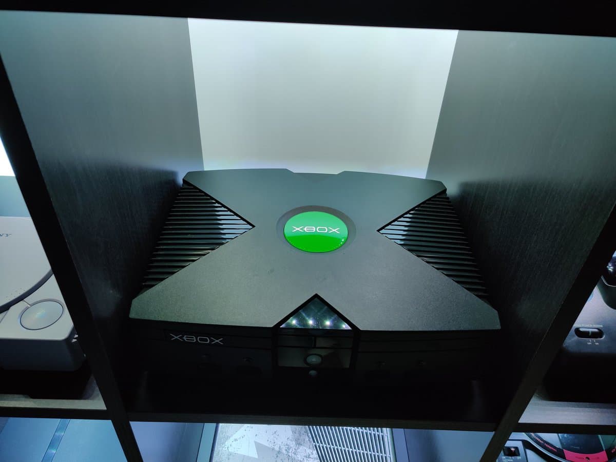 Original Xbox startup screen displaying green logo and boot animation on CRT monitor during refurbishment testing phase.