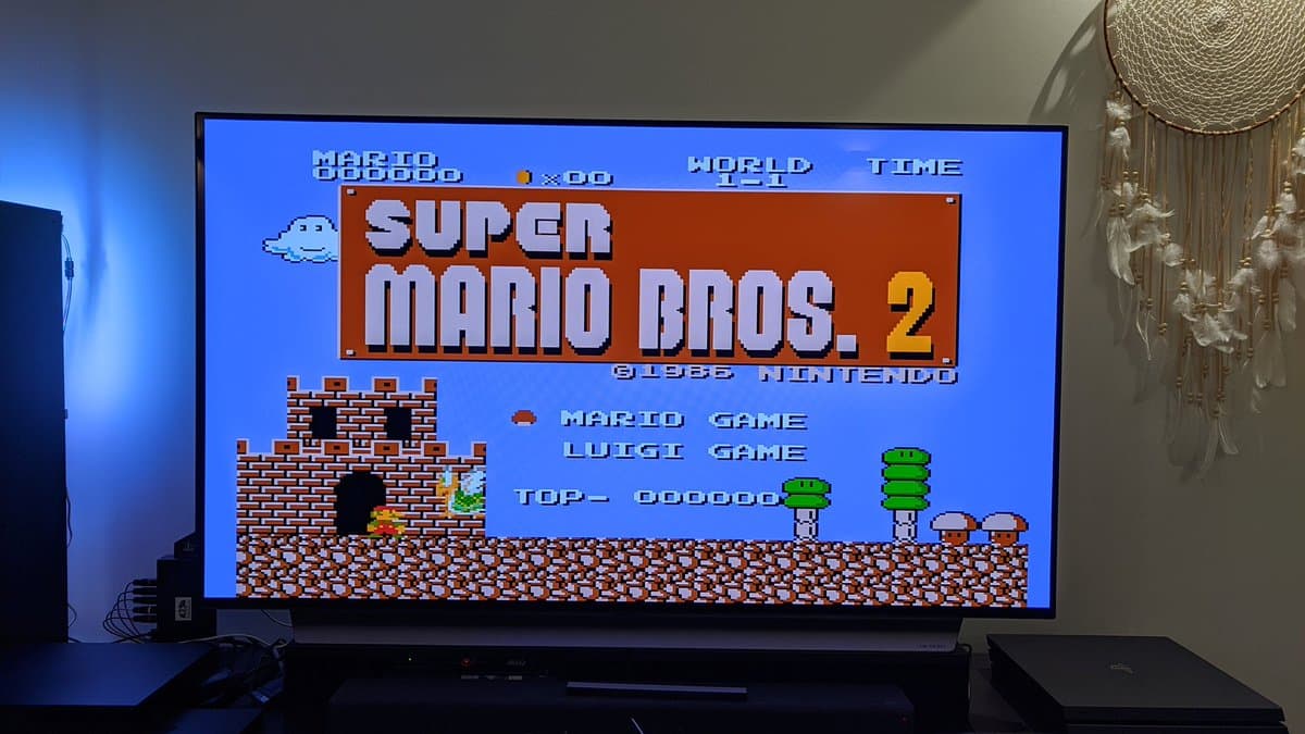 Super Mario Bros. 2 title screen on Sharp Twin Famicom with NESRGB mod displaying clean RGB output without scanlines via wireless connection.