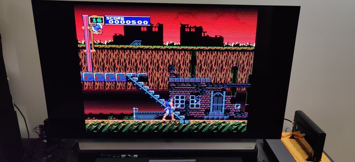 Castlevania III running on NEC PC Engine Super CD-ROM2 with RGB mod, displaying castle level with score 0000500 on CRT monitor.