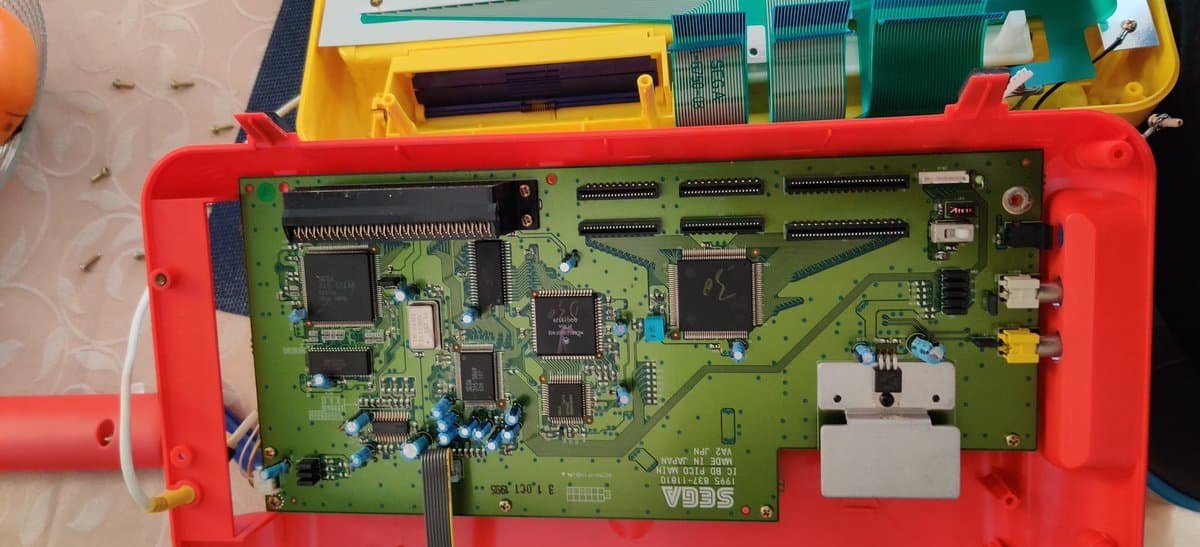 First-gen Sega Pico mainboard with replaced capacitors and 7805 regulator, cleaned and ready for testing.