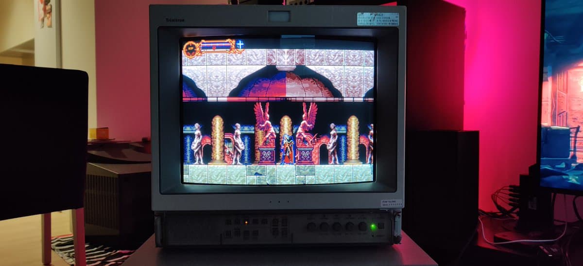Sony PVM-14L2 CRT displaying Castlevania: Symphony of the Night preview level on Sega Genesis, vibrant colors and geometry rendered clearly.