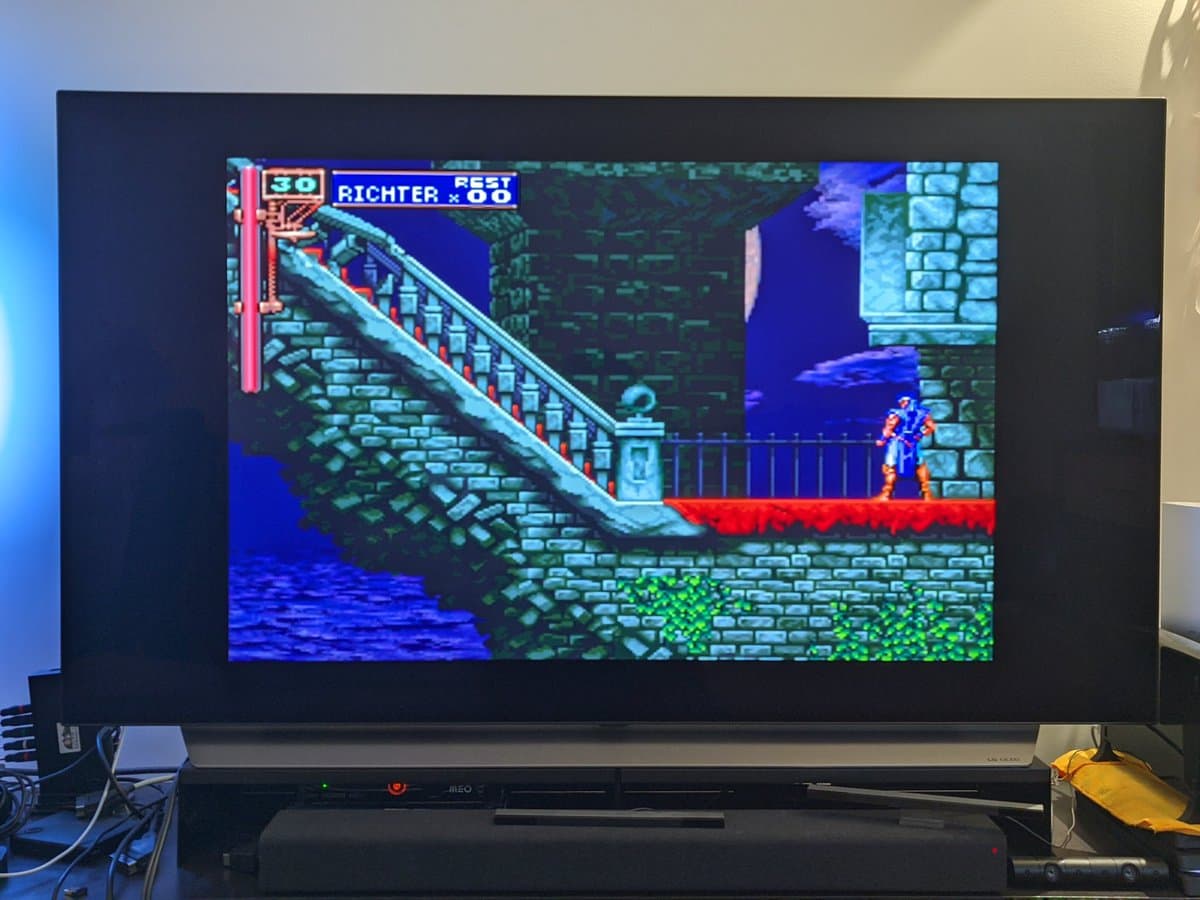 Sony Vita TV displaying Castlevania: Symphony of the Night, connected to modern flat-screen TV with game visible on-screen.