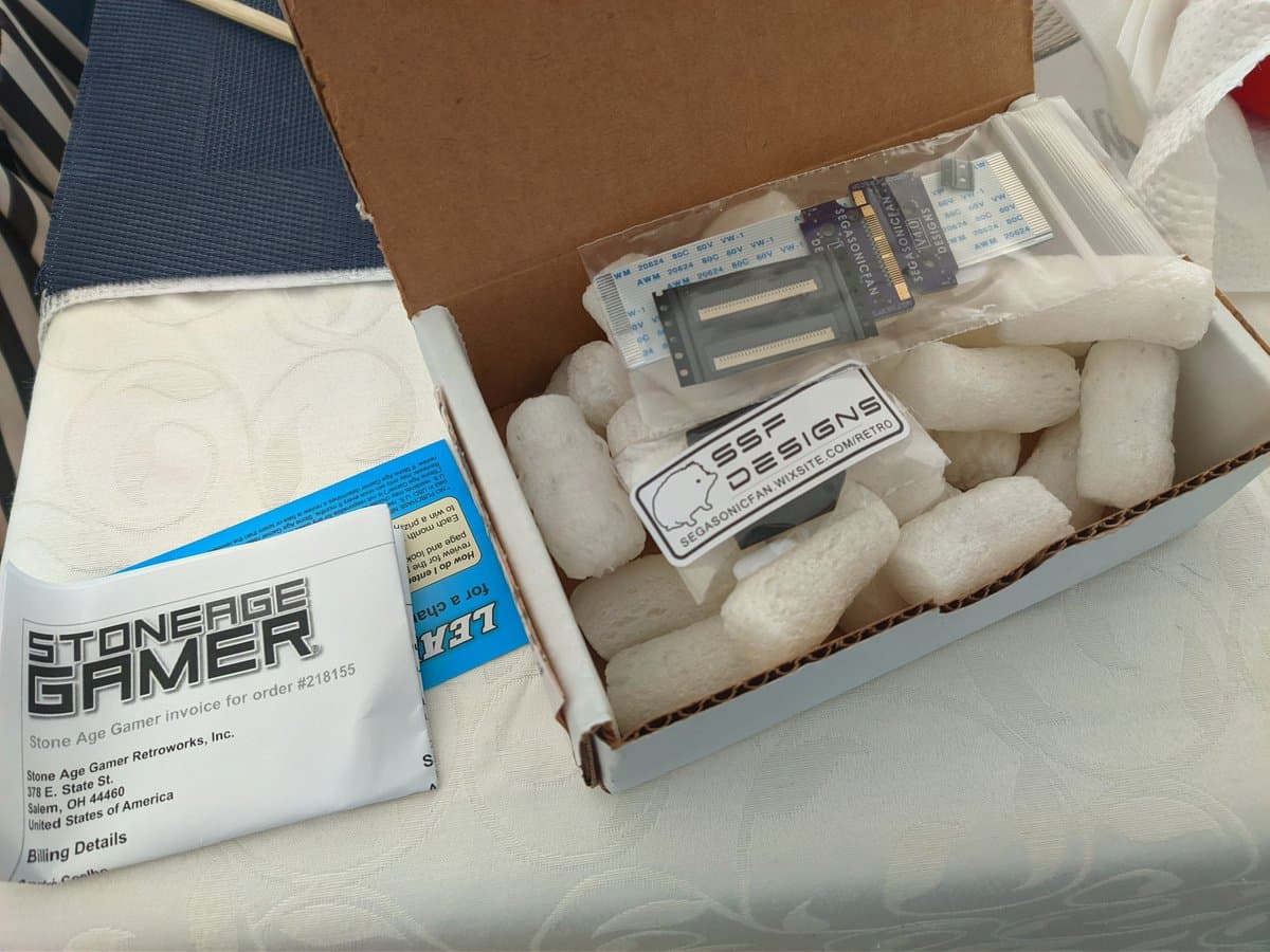 Virtual Ribbon 4.0 and repro stand from Stone Age Gamer, shipped with protective packaging and documentation for Virtual Boy refurbishment.