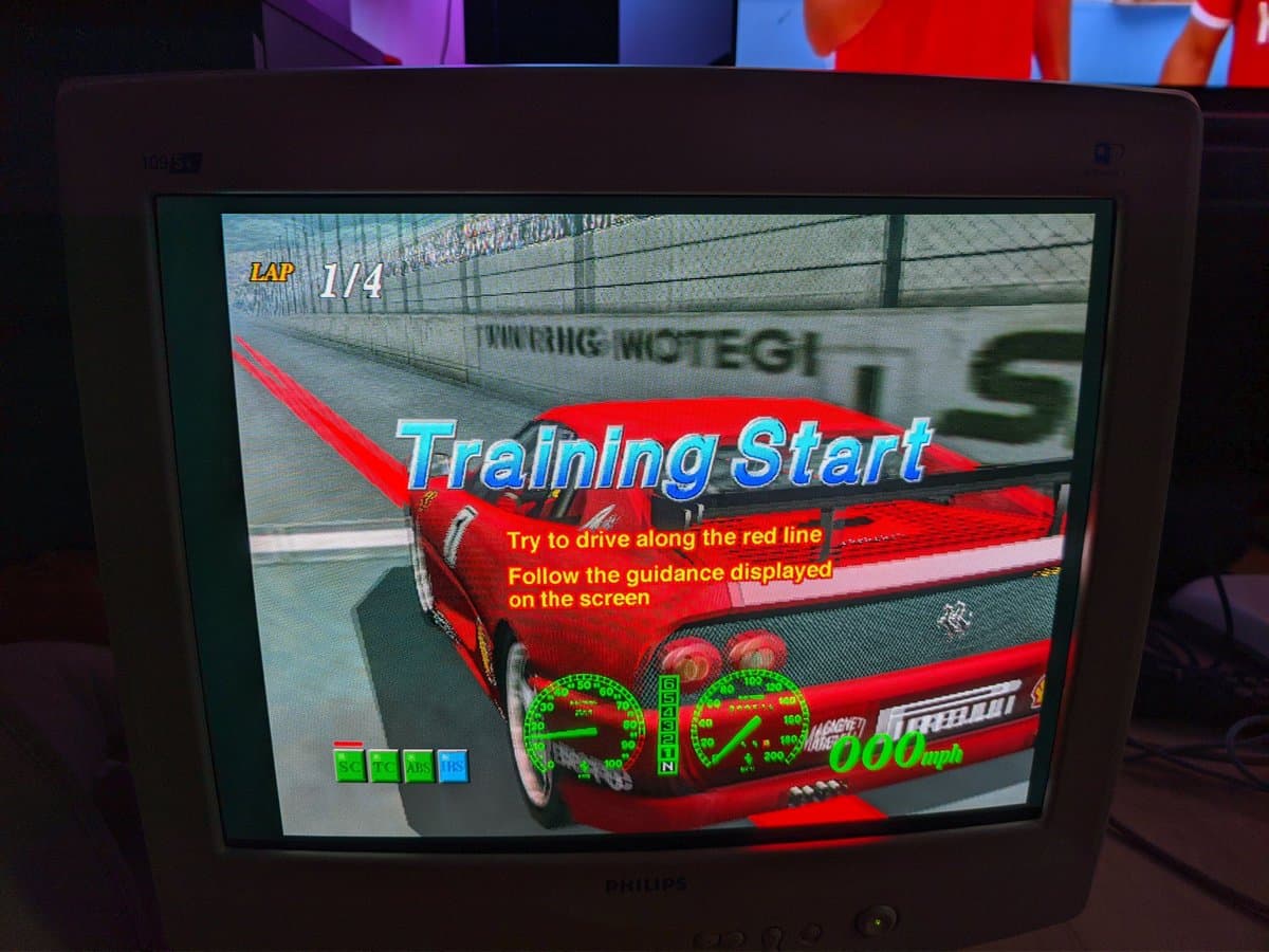 Philips 109S4 CRT displaying Dreamcast racing game via VGA, showing good image quality with vibrant colors and sharp text rendering.