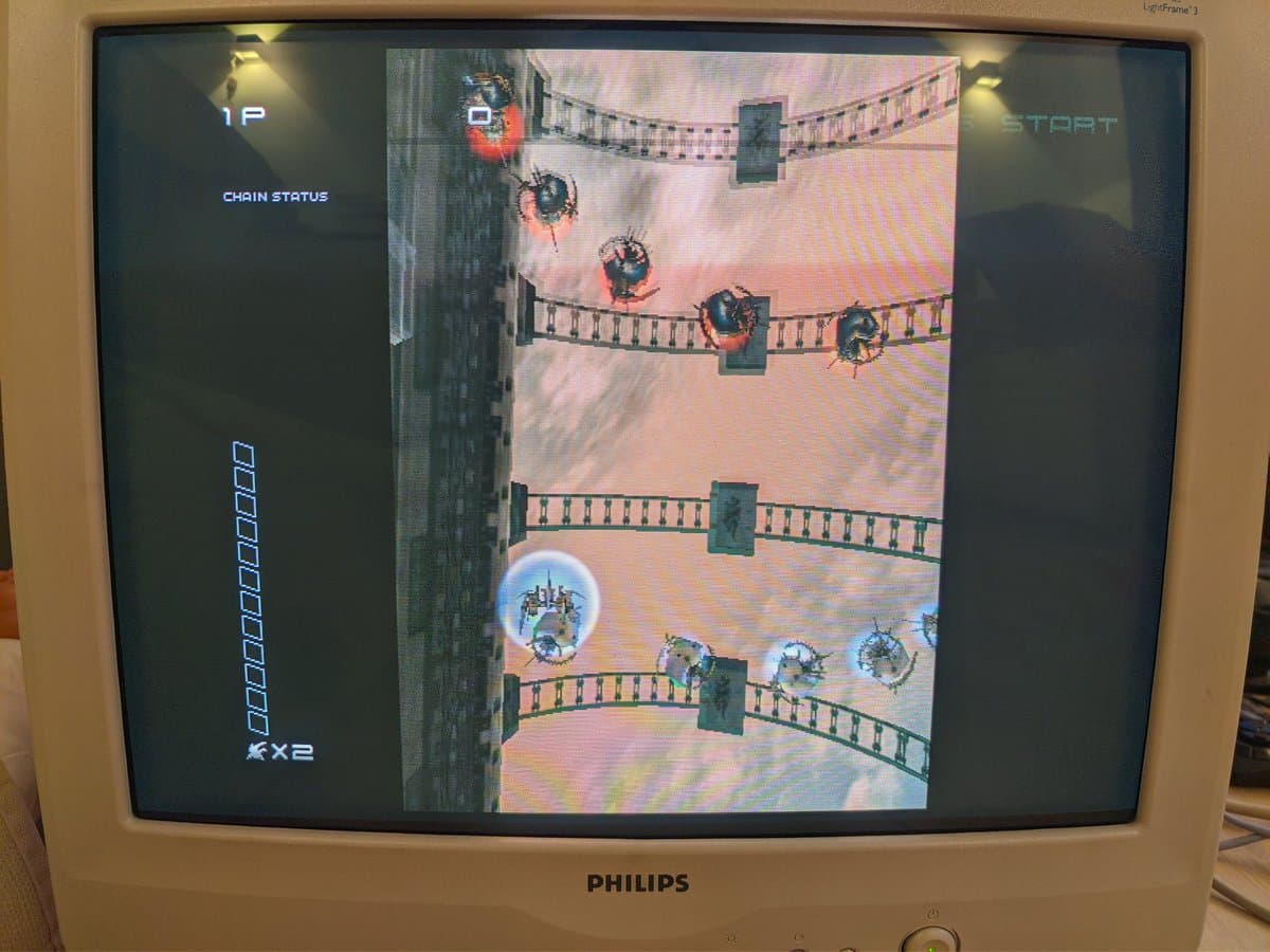Philips 109S4 CRT displaying Ikagura arcade game; aperture grille monitor showing castle stage with enemy sprites and UI elements.