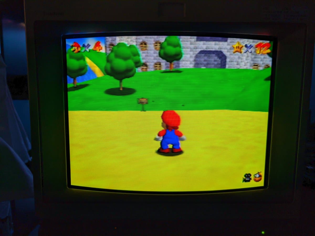 Super Mario 64 gameplay on N64 display, validating successful console restoration and controller repair work.