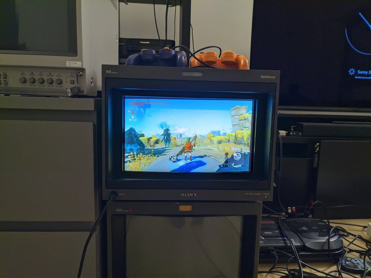 Sony BVM-D14H1E CRT displaying Legend of Zelda: Tears of the Kingdom gameplay in a restoration setup with test equipment visible.