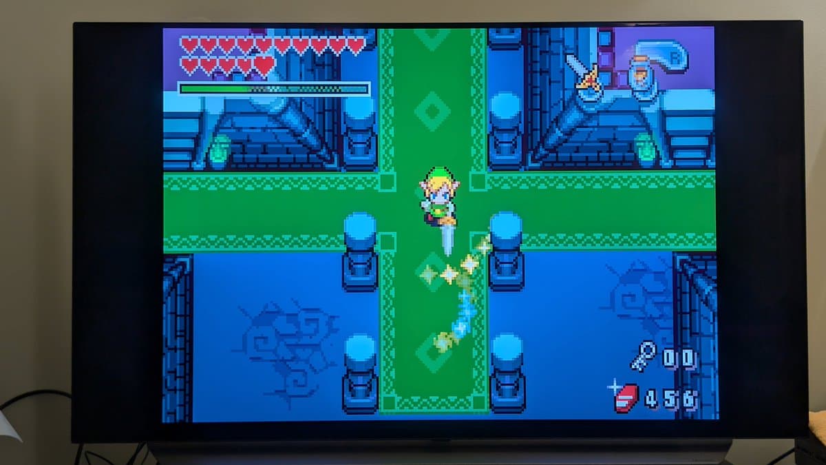 The Legend of Zelda: A Link to the Past gameplay screenshot showing a cleaned cart slot allowing proper boot and uncorrupted Nintendo logo display.