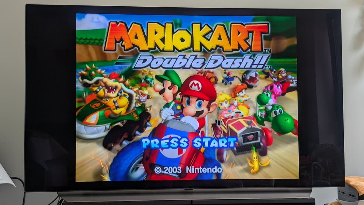 Mario Kart: Double Dash title screen displaying on restored Panasonic Q, showing successful optical drive repair and FlippyDrive installation.