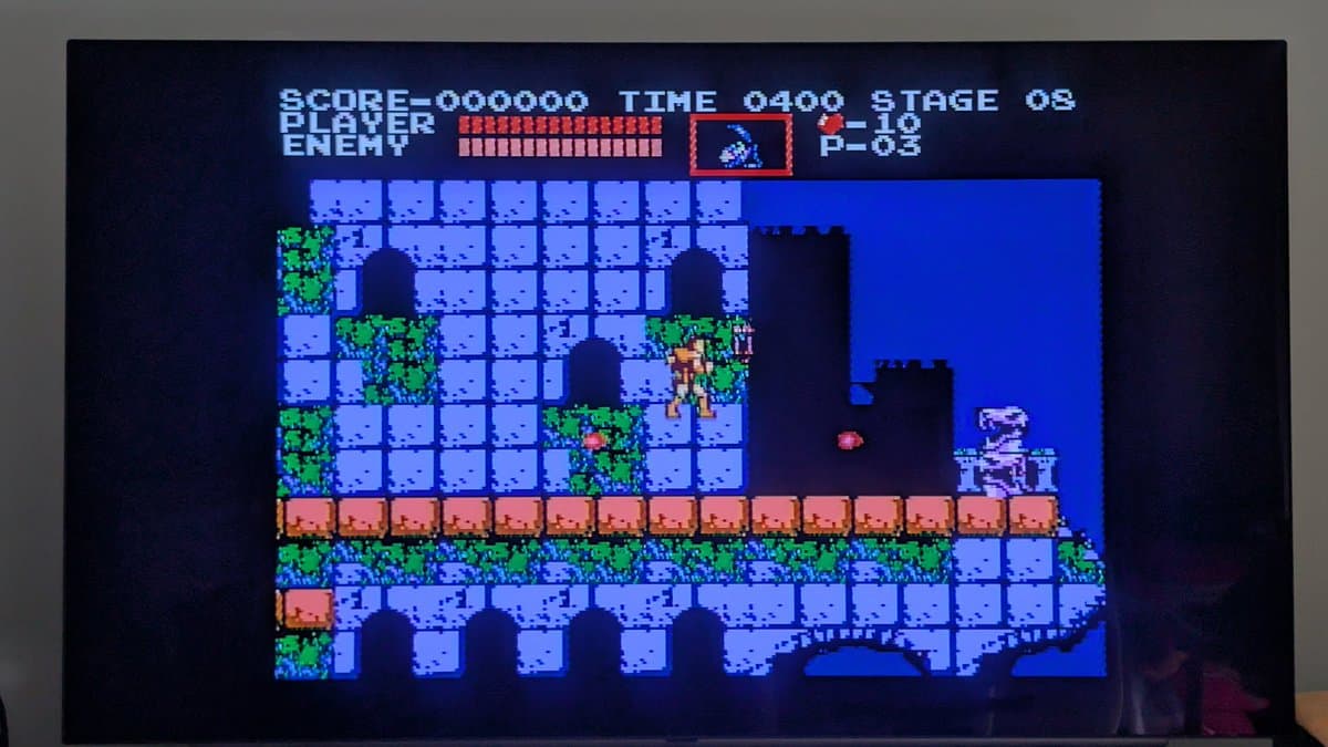 Castlevania gameplay on recapped AV Famicom displaying stage 08 with player character on castle platform, demonstrating successful repair after oxidation cleanup and capacitor replacement.