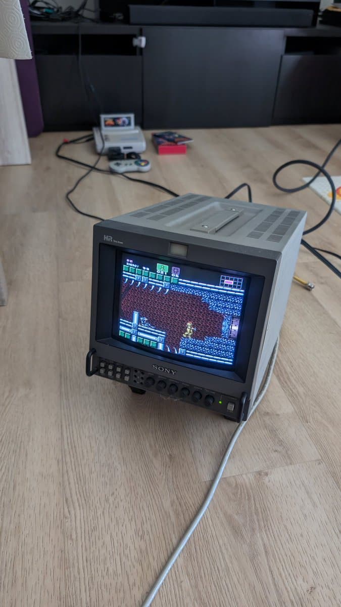 Sony PVM monitor displaying Super Famicom Jr. gameplay output, demonstrating successful video signal after recapping and restoration work.