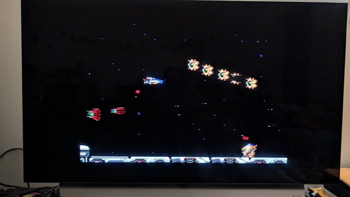 Master System displaying R-Type gameplay with enemy formations and player ship on screen after refurbishment and testing.