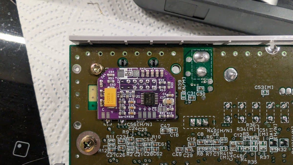 Borti4938 RGB mod board installed in Super Famicom Jr. motherboard with upgraded brightness and ghosting fix components visible.