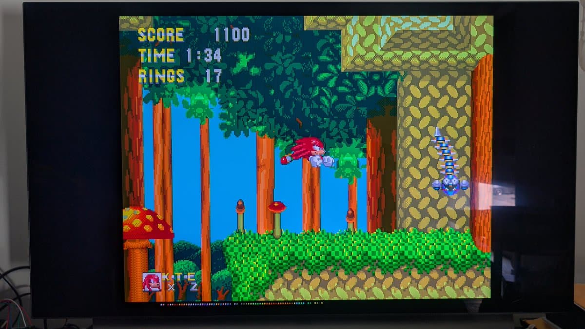 Sega Mega Drive running Sonic the Hedgehog 2, displaying score 11100, time 1:34, rings 17 during post-repair test run.