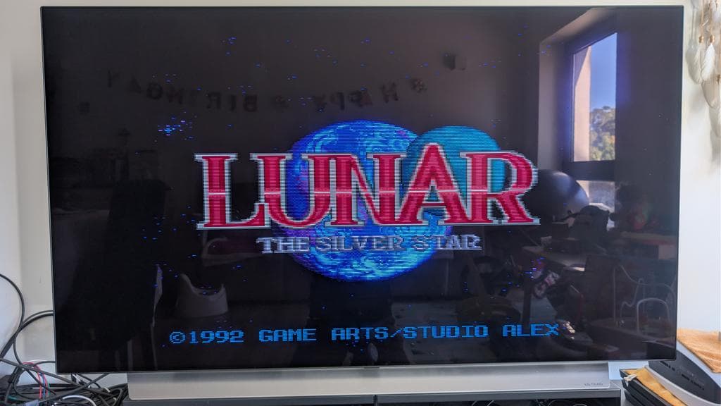 Sega Mega-CD startup screen displaying "Lunar: The Silver Star" title, copyright 1992 Game Arts/Studio Alex, on CRT monitor during restoration testing.