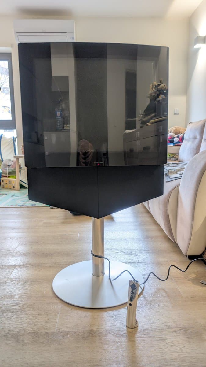 Bang & Olufsen Beovision 1 CRT displaying perfect picture on pedestal stand in living room after magic smoke incident repair.