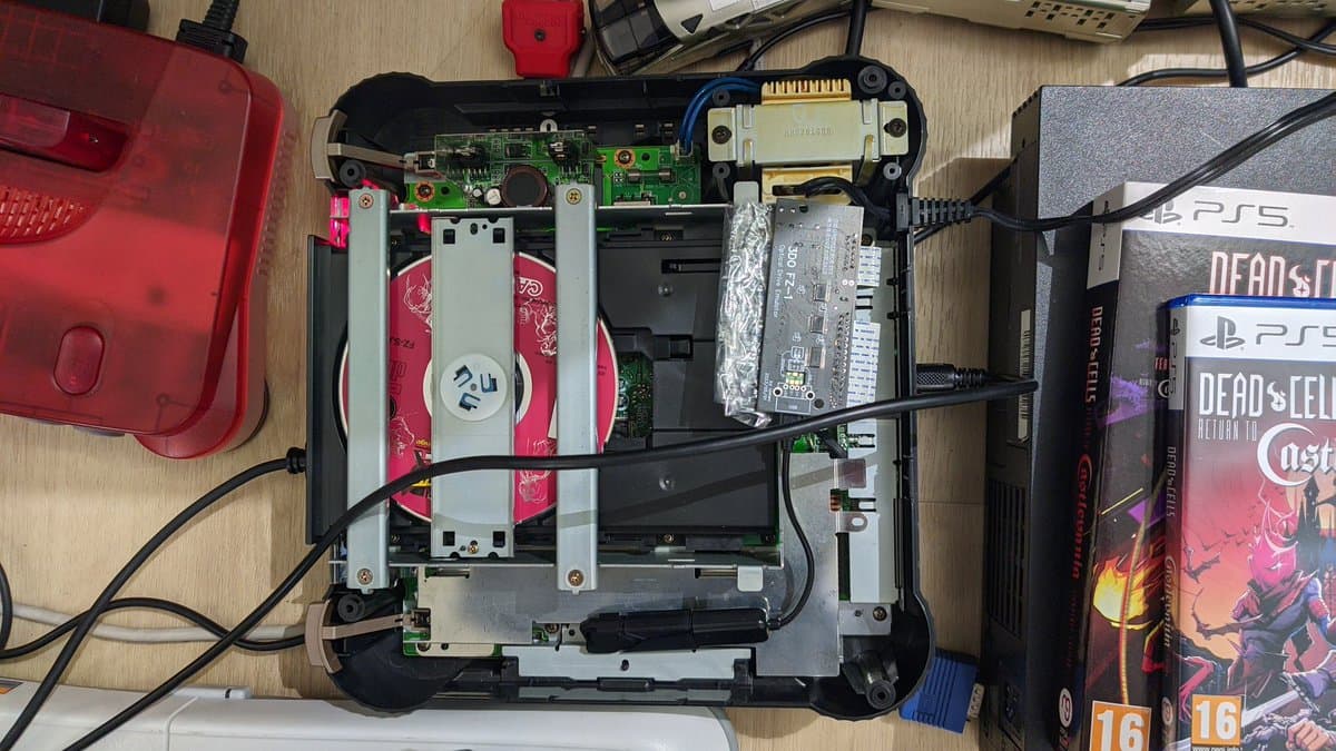 Panasonic FZ-1 3DO internals with recapped board, ODE module installed, and external power supply connected during testing.