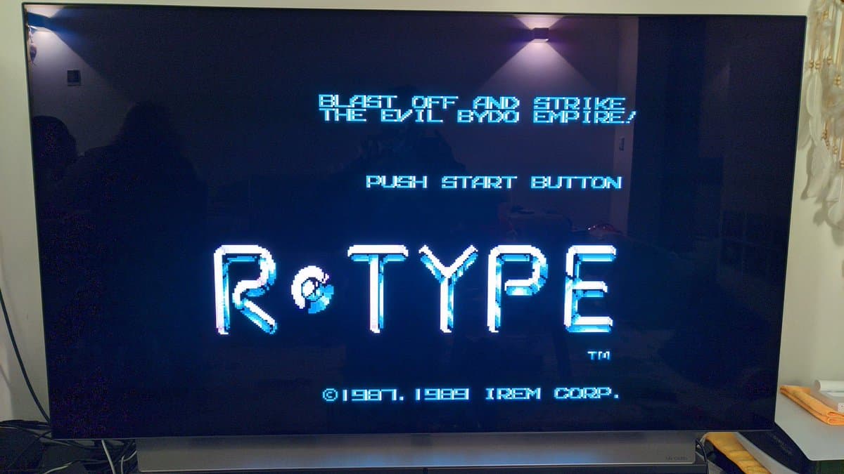R-Type title screen on Sharp X68000 Pro II displaying cyan pixel-art text and copyright notice after successful restoration.