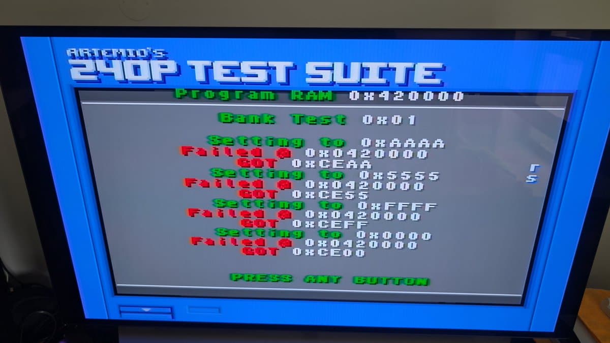 Artemio's E40P Test Suite showing Program RAM failure at 0x420000 and multiple "Failed" bank switching errors in green and red text.