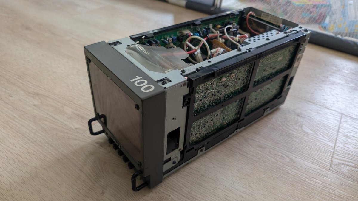 Sony PVM-6041Q with top cover removed, exposing circuit boards, transformers, and wiring after cleaning and reassembly.