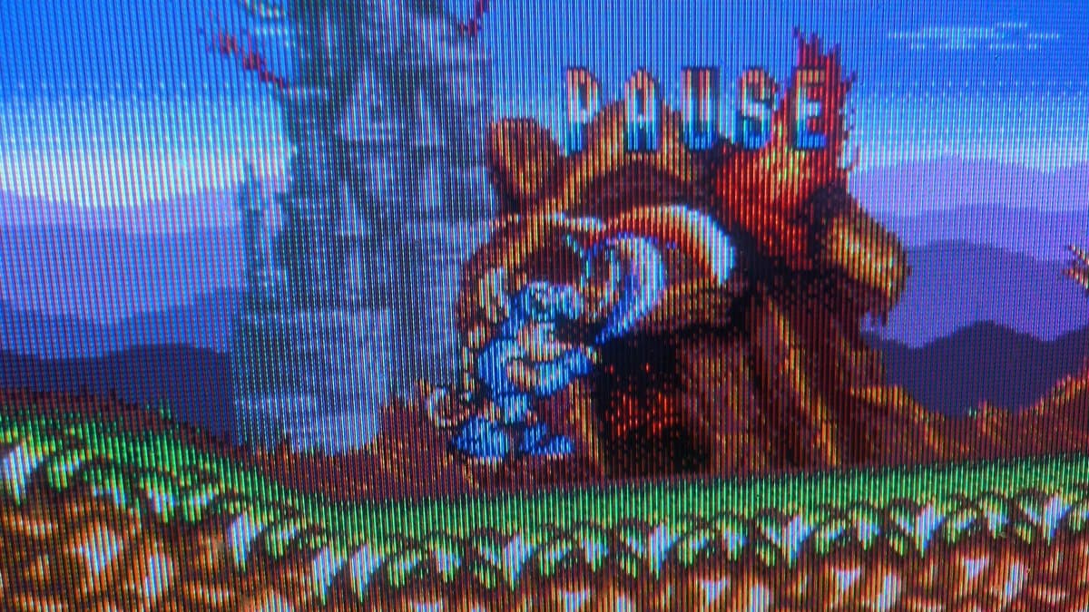 Rocket Knight Adventures gameplay displayed on restored Sony PVM-6041Q CRT monitor via Sega Nomad RGB output; vibrant castle scene visible.