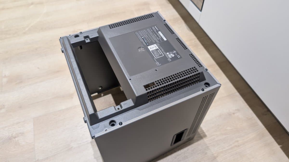 Open Sony PVM-14L1 case showing installed RGB mod PCB with heatsink and internal components during assembly.