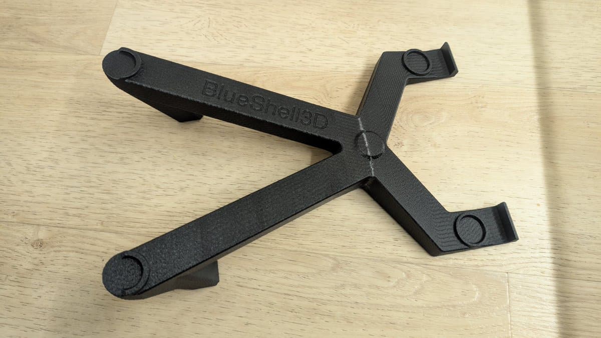 BlueShell3D 3D-printed monitor stand for 9" Sony PVM, black plastic with adjustment knobs, displayed on wooden surface.