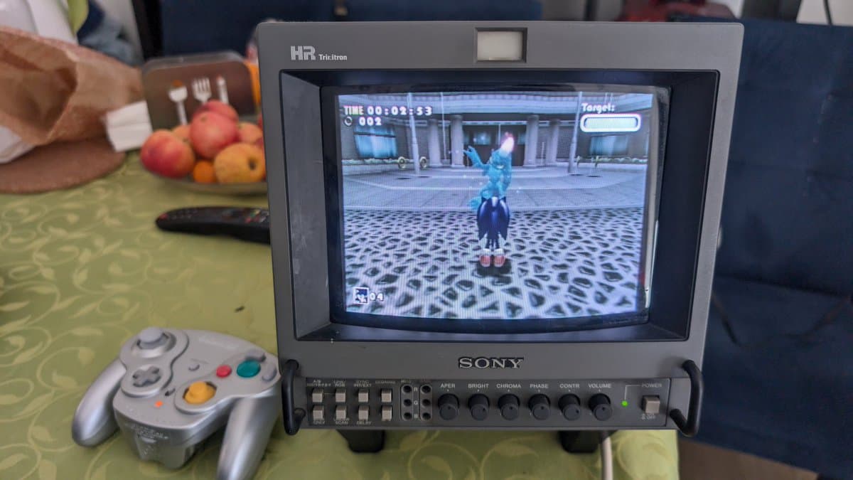 GameCube motherboard displaying mostly polymer capacitors during PAL DOL-101 recap; single capacitor replacement completed due to minimal electrolytic cap usage.