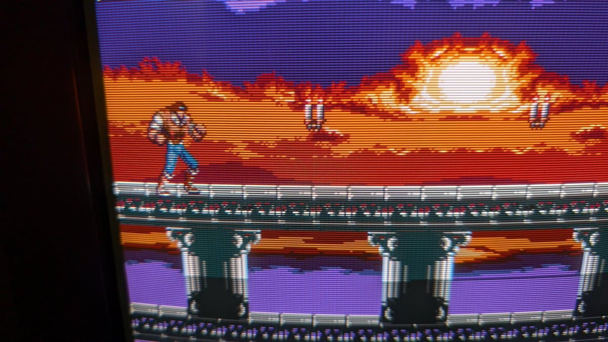 Castlevania gameplay on repaired Sony PVM-14M4J showing vibrant colors restored, desert stage with character, columns, and sunset sky displaying proper color output post-repair.