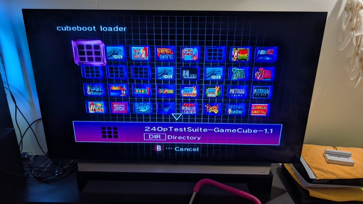 CubeJam loader menu displaying GameCube game library with 240pTestSuite directory selected, ready to launch games on modded console.