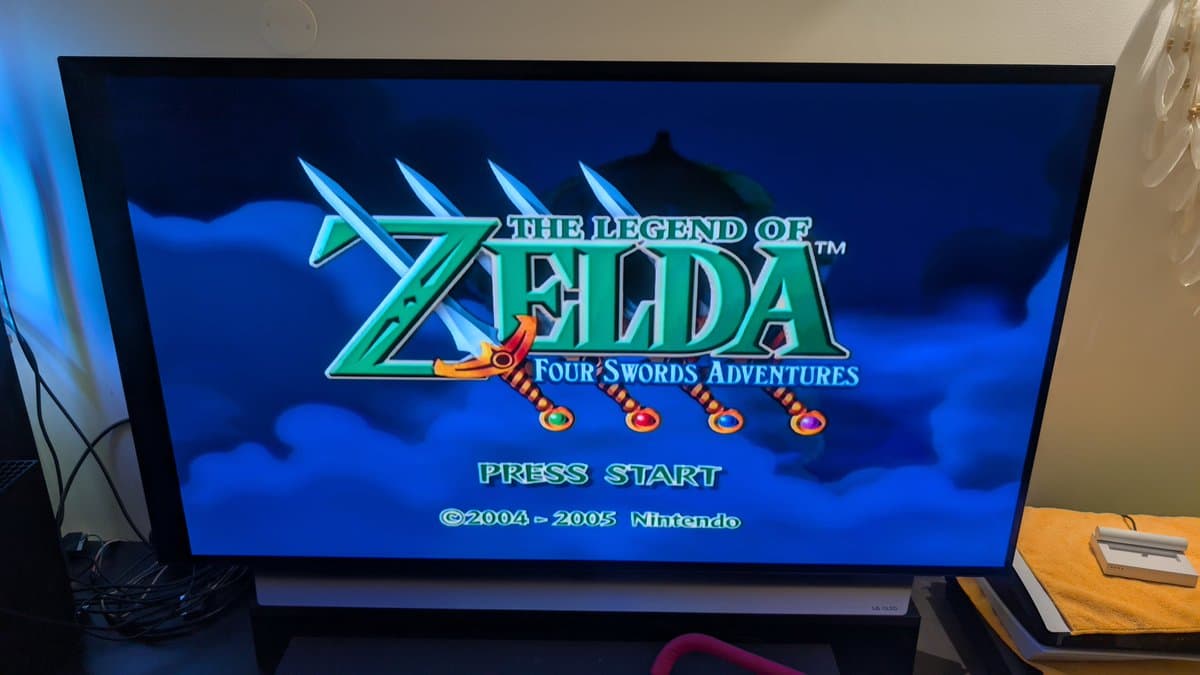 The Legend of Zelda: Four Swords Adventures title screen displayed on a TV, testing the restored spice orange GameCube with Picoboot and FlippyDrive ODE.