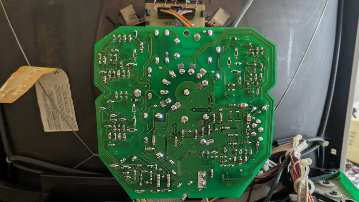 Bang & Olufsen Beovision 1 neck board after recapping and cleaning; reflowed solder joints visible on green PCB with components.
