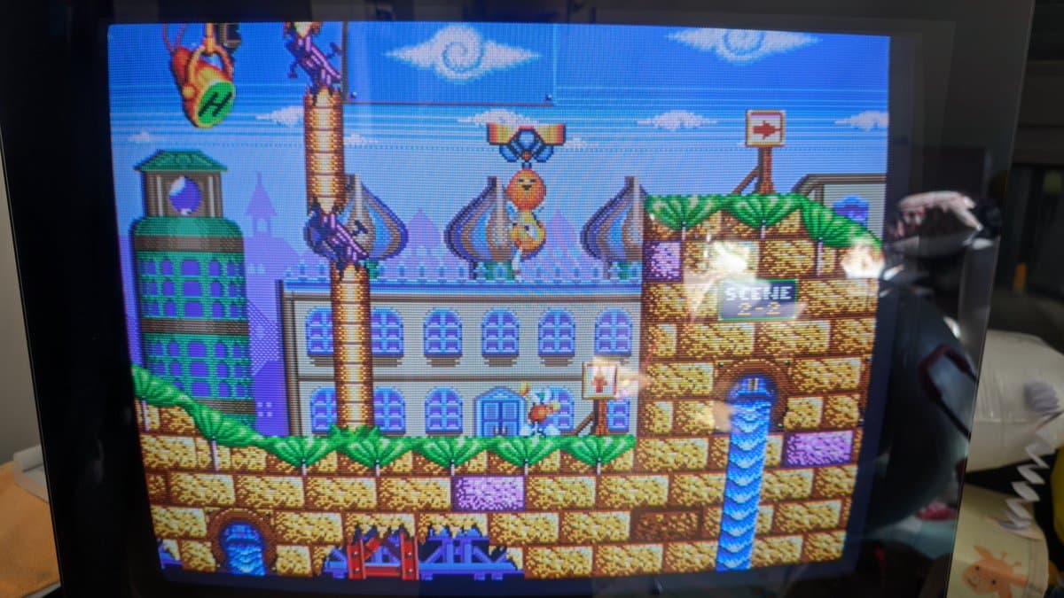 Bang & Olufsen Beovision 1 displaying vibrant arcade game graphics after X2 safety cap repair and Velocity Scan Modulation disconnection.